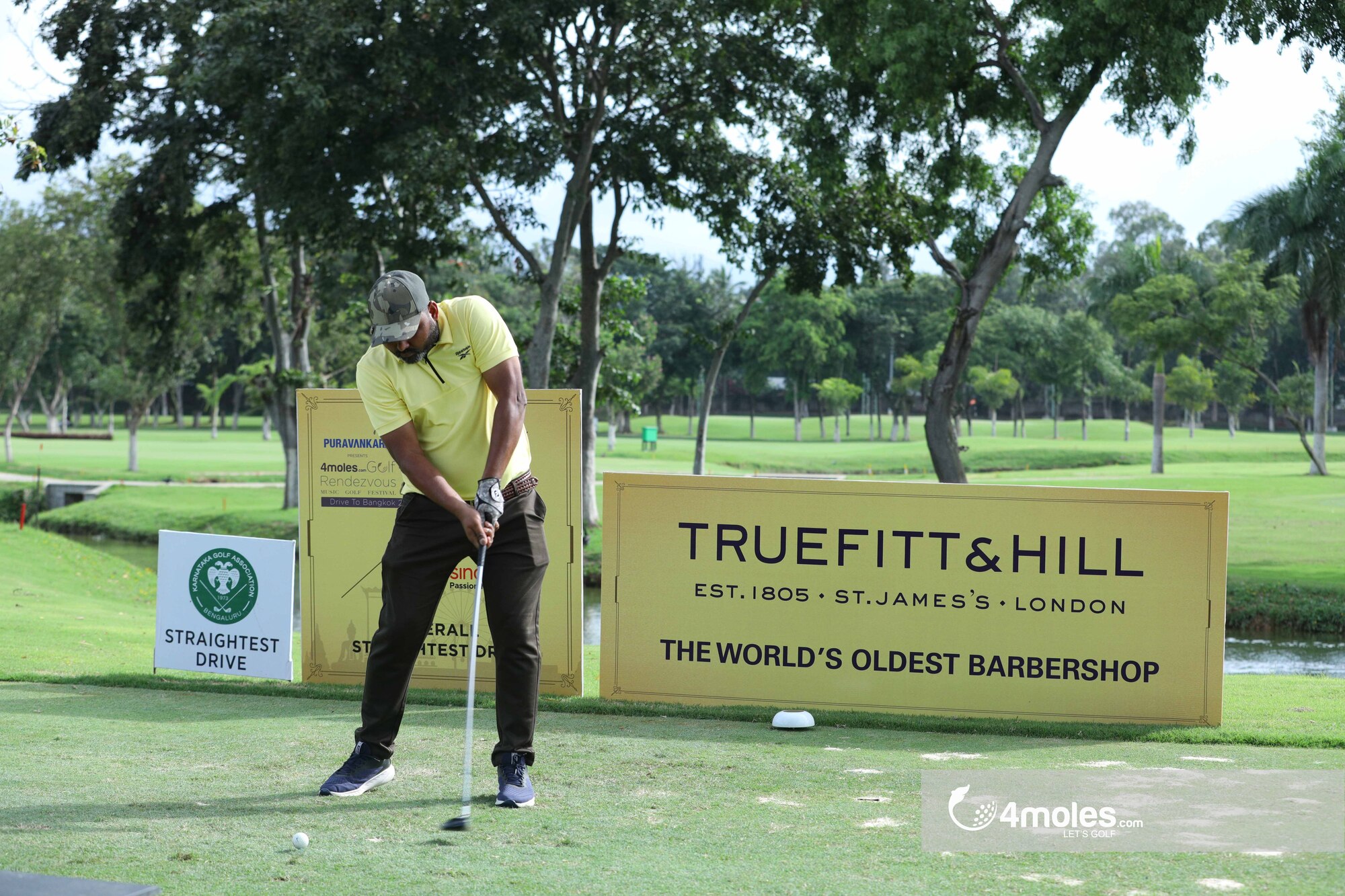 Male golfer preparing to tee off.