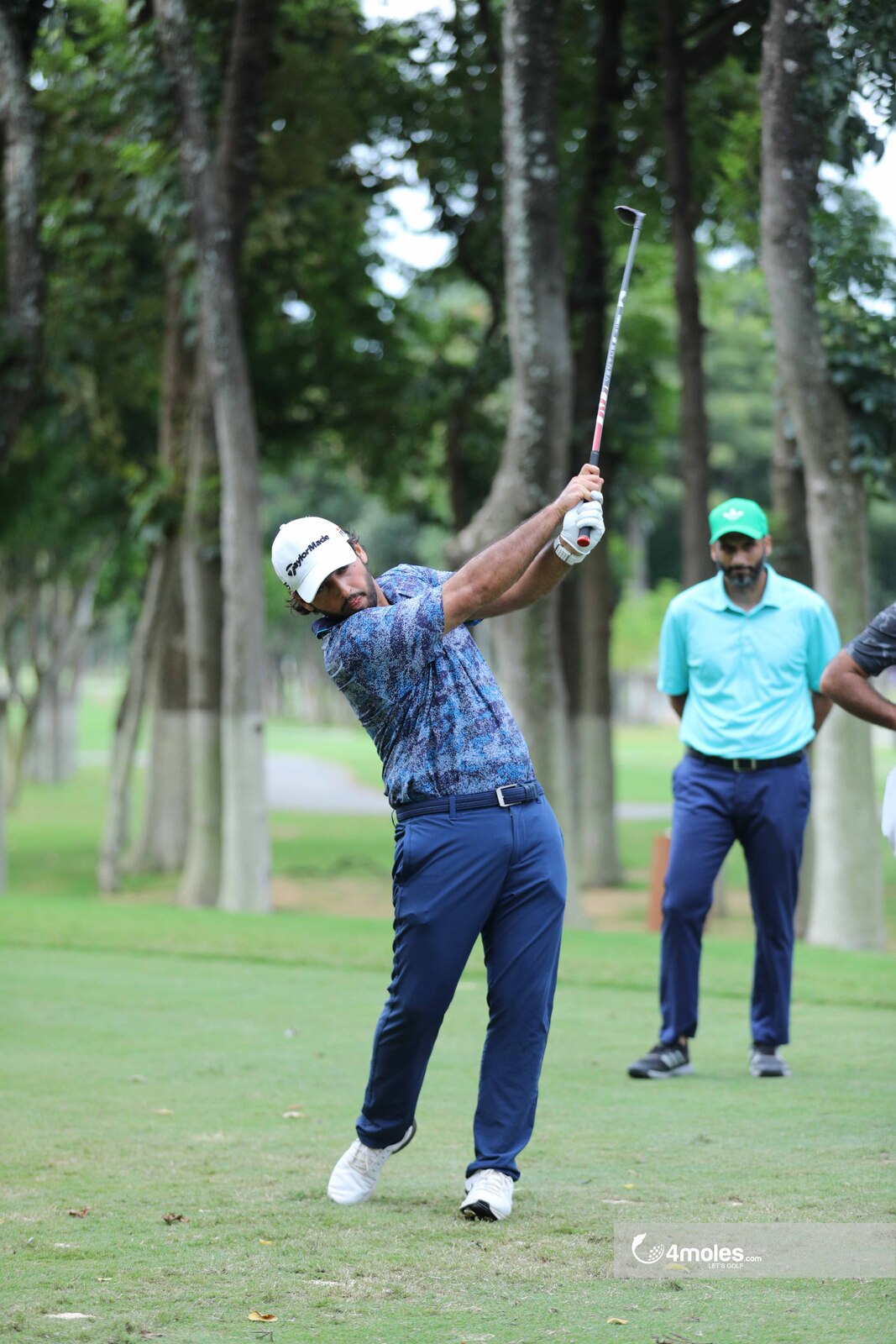 Focused golfer executing a precise shot.